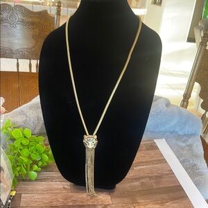 Elegant Gold Necklace with Ornate Pendant and Tassel